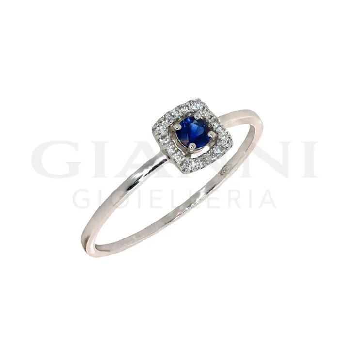 Anello Crivelli - Zaffiro centrale e contorno di Diamanti in Oro Bianco Anelli